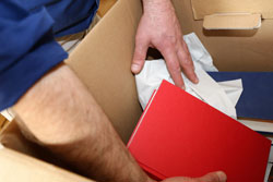 man unpacking a box